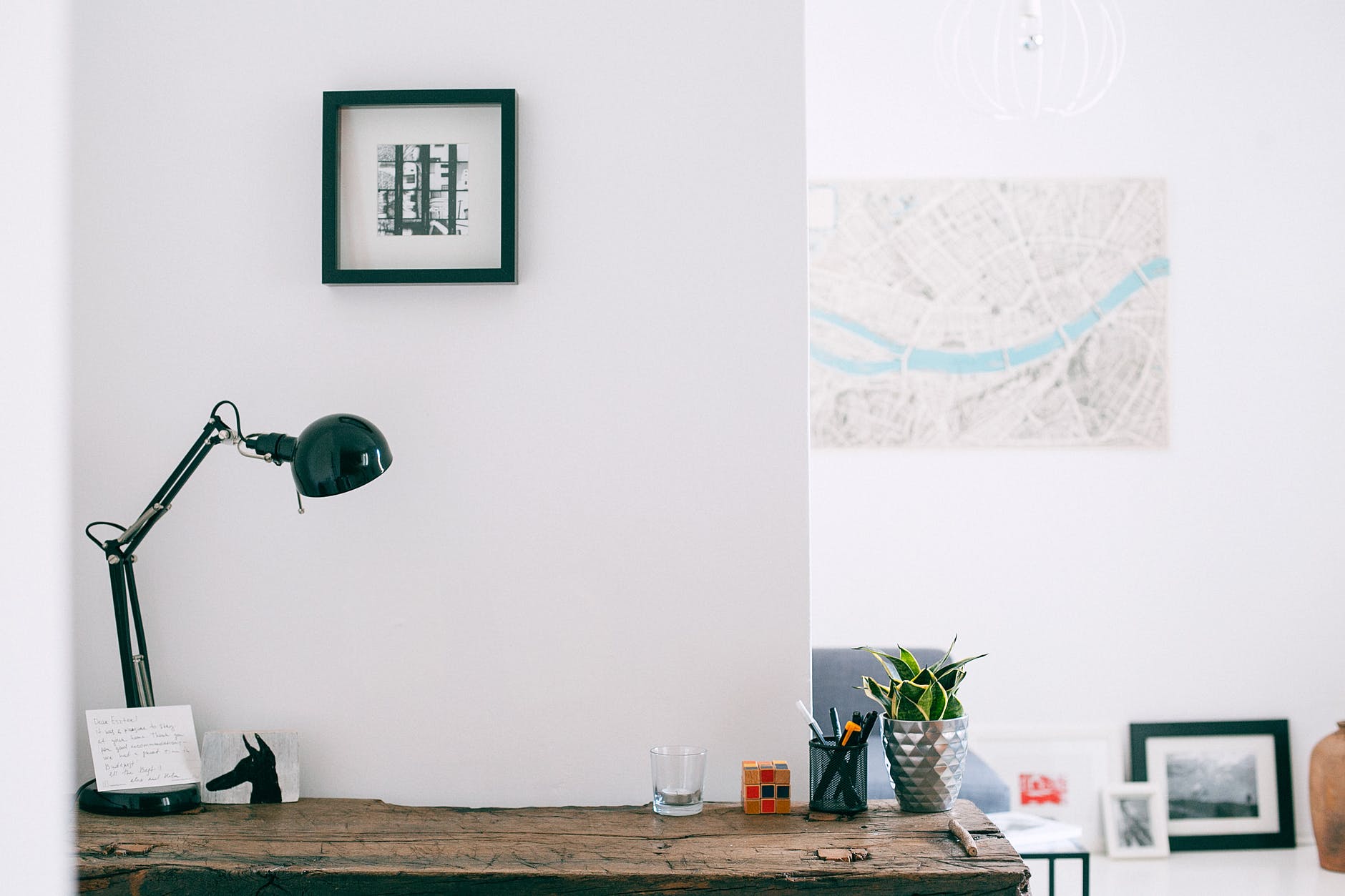 desk with lamp and stationery in modern apartment